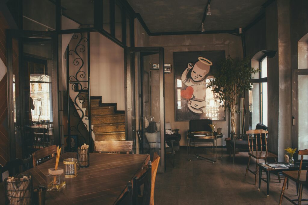 Warm and inviting restaurant interior featuring modern design elements and artistic wall decor.